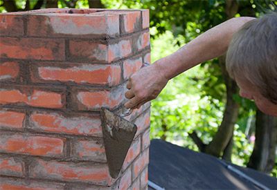 JM Masonry, Concrete & Excavating building chimney